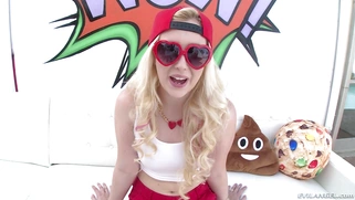 Samantha Rone posing in tight tank top, red shorts and backwards cap