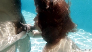 Kira Perez and Fiona Frost are sucking the cock in the pool