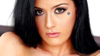 Katrina Jade shows off her body in a black mesh mini-dress