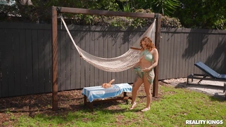 Aria Kai is playing with the dildo outdoors