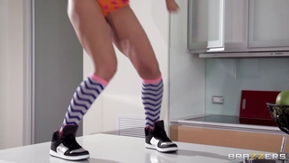 Isis Love dancing and stripping on the kitchen table