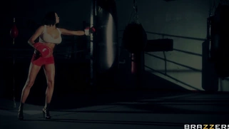 Boxer girl Aryana Augustine hitting the bag in the gym