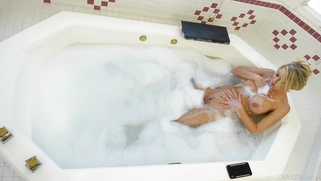 Katie Morgan is playing with her big tits and pussy in the bathtub