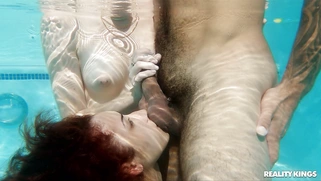 Kira Perez and Fiona Frost are sucking the cock in the pool