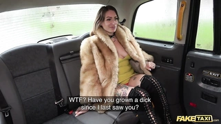 Ava Austin is riding a large black dildo in the back seat of a fake taxi