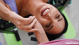 Anissa Kate is sucking Jordi's cock on the gym bench