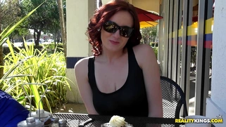 Audrey Grace eating a piece of cake and flashing her natural boobs