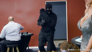 Bridgette B and Nina Kayy show off their huge tits to a pair of robbers