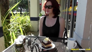 Audrey Grace eating a piece of cake and flashing her natural boobs