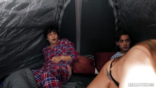 Britney Amber serves two cocks in the tent