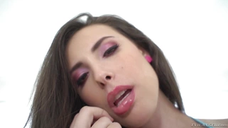Brunette Casey Calvert posing in the tiny bikini