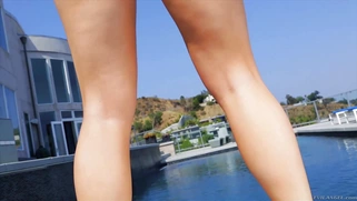 Ashley Fires models a skimpy bikini and and black stiletto heels