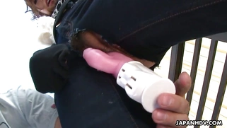 Emiri Seo gets her hairy pussy dildoed through the hole in her pants