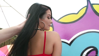 Tattooed vixen Katrina Jade poses in tight fishnet dress