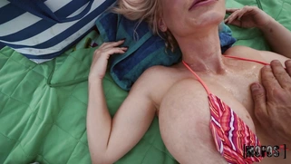 Busty mom Casca Akashova is relaxing in the park